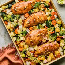 baked chicken and veggies on a sheet pan