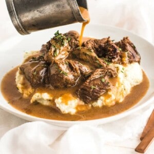 keto crockpot recipes, beef tips and gravy over cauliflower mash.
