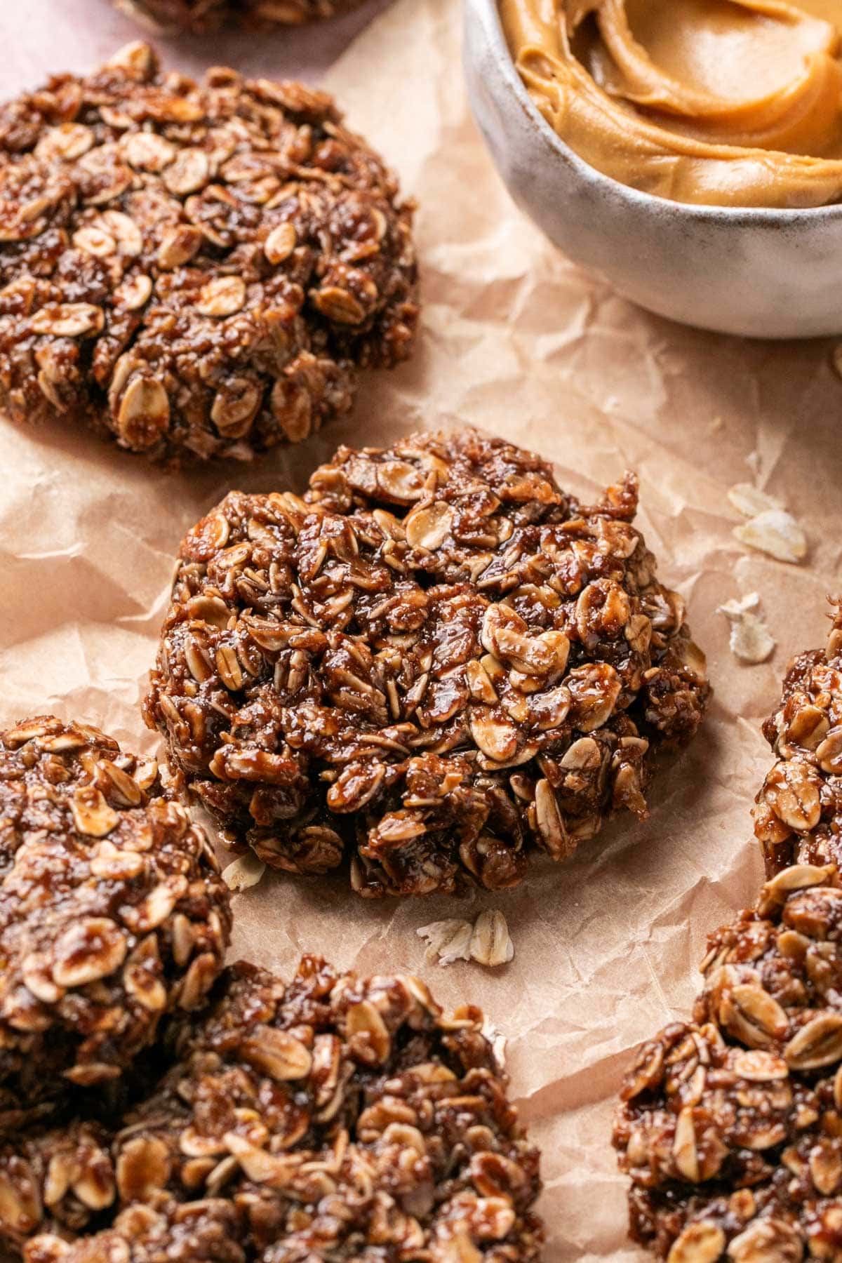 an up close shot of a cookie on parchment paper 