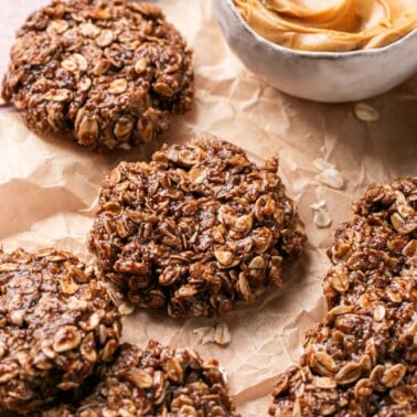 an overhead shot of protein cookies next to a bowl of peanut butter and oats