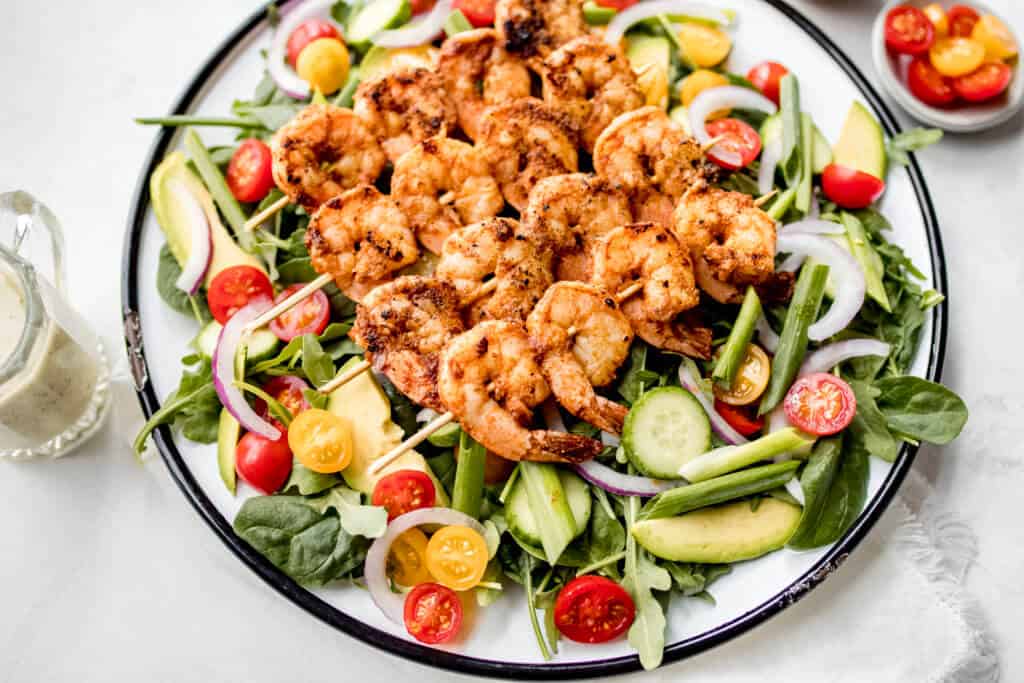 A crisp salad topped with blackened shrimp and drizzled with Citrus Herb Dressing
