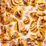 cinnamon roll breakfast casserole drizzled with frosting