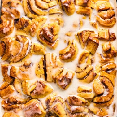 cinnamon roll breakfast casserole drizzled with frosting