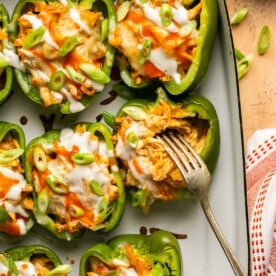 buffalo chicken stuffed peppers in a baking dish