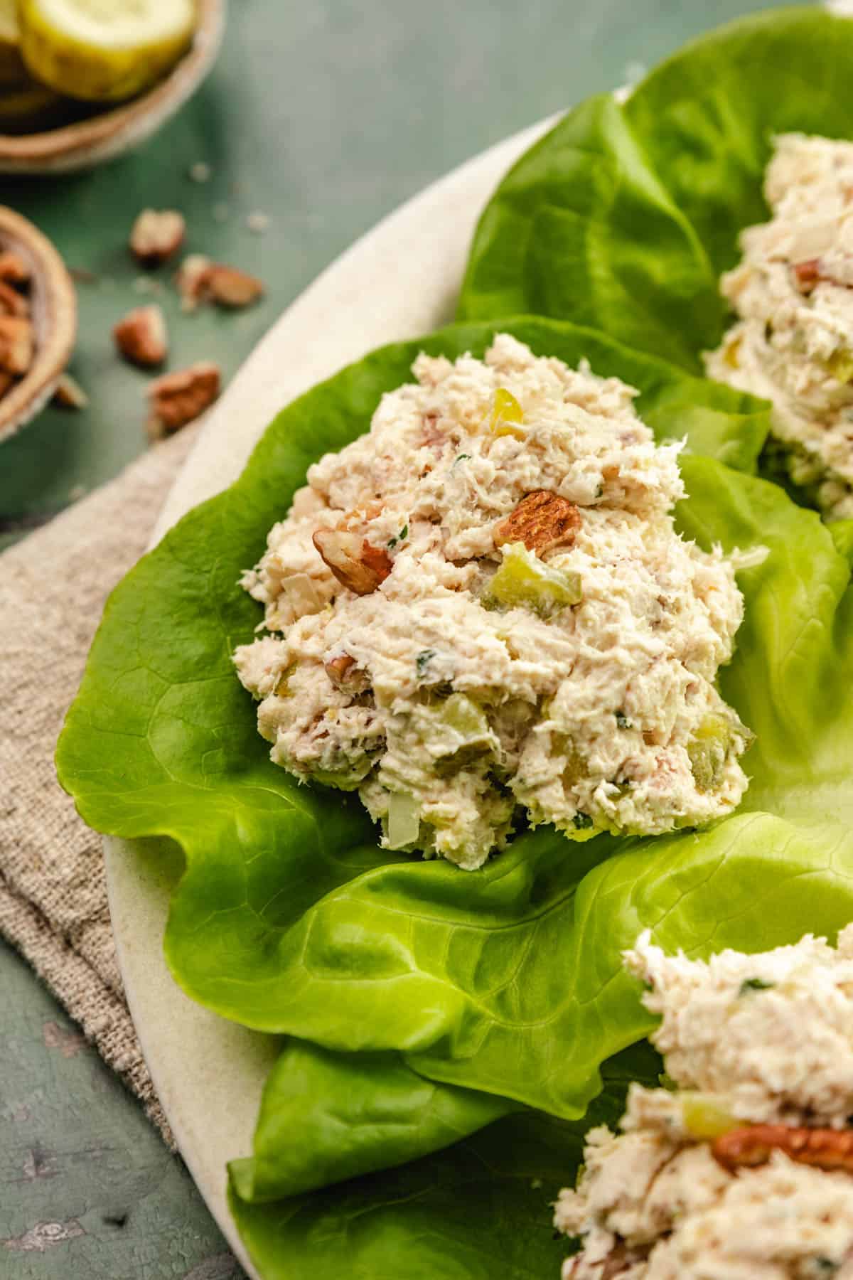 a scoop of rotisserie chicken salad on piece of lettuce