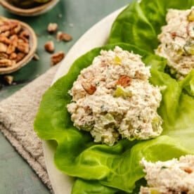 a scoop of rotisserie chicken salad on piece of lettuce