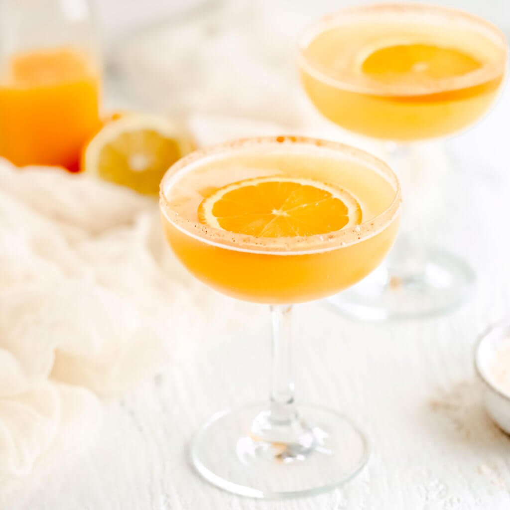 A photo of the cocktail with a orange slice