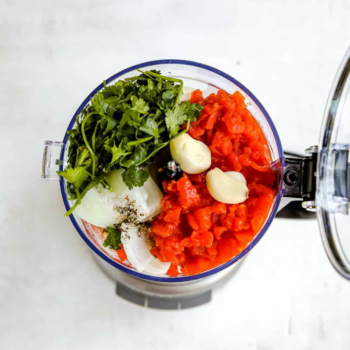 ingredients for garden fresh salsa in a food processor before blending 