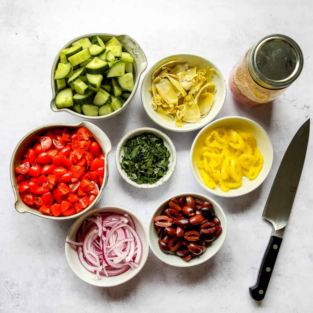 The perfect Keto Mediterranean Greek Salad. This salad is not only a breeze to make, but it's also super healthy. It requires simple and fresh ingredients that are coated in a yummy homemade Greek dressing. The perfect side dish to serve with any protein option.  