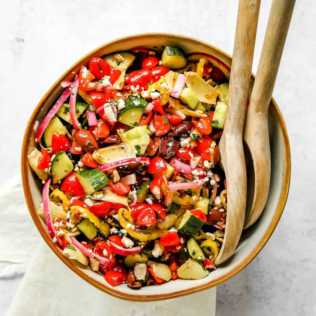 The perfect Keto Mediterranean Greek Salad. This salad is not only a breeze to make, but it's also super healthy. It requires simple and fresh ingredients that are coated in a yummy homemade Greek dressing. The perfect side dish to serve with any protein option.  