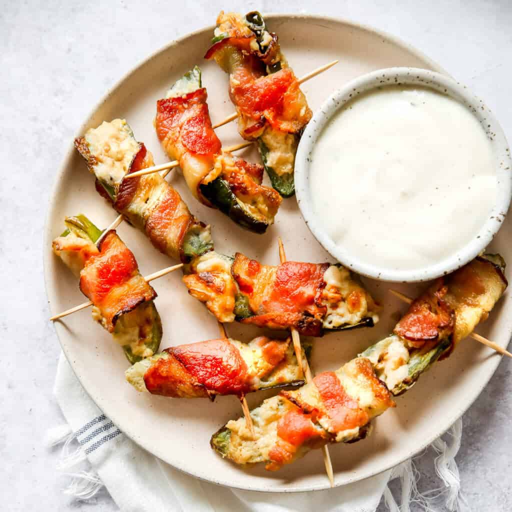 Keto Jalapeno Poppers on a plate with ranch dressing