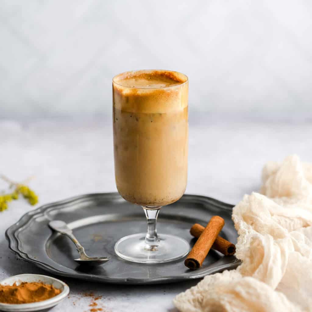 Whipped Coffee with pumpkin mixed together in a glass