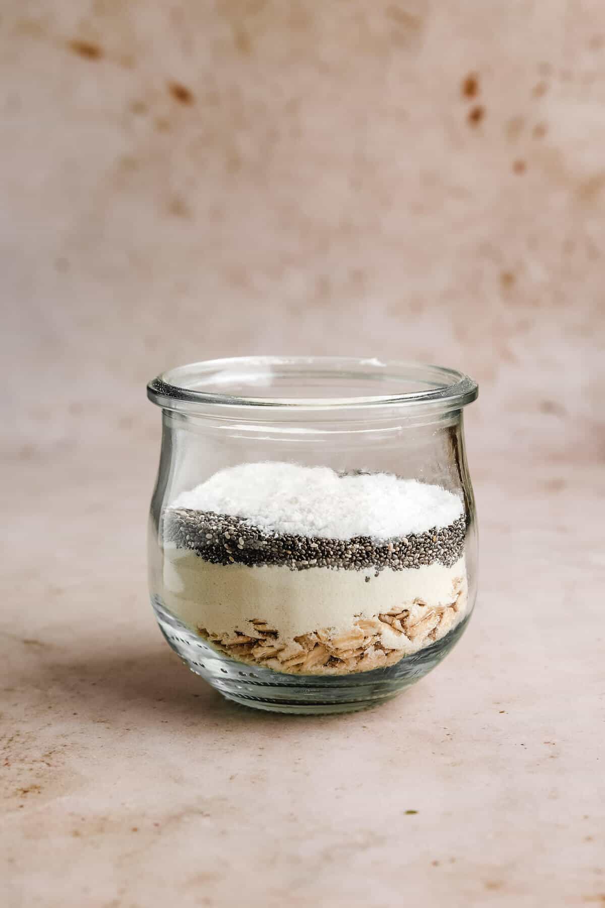 a glass jar filled with dry ingredients