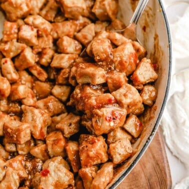 a closeup of pork bites in a large bowl