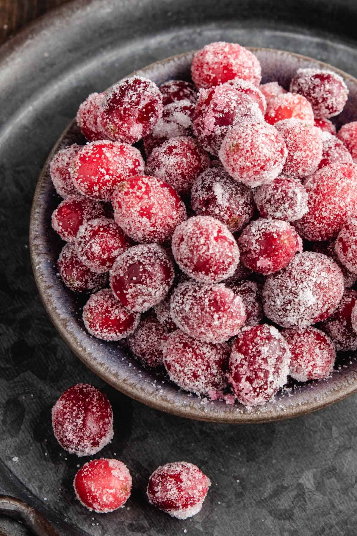 a close up of cranberries coated in sugar