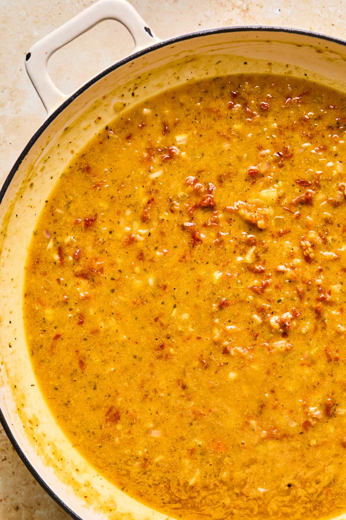 the sauce combined and simmering in the pan 