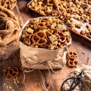 a brown paper bag filled with gluten free chex mix.