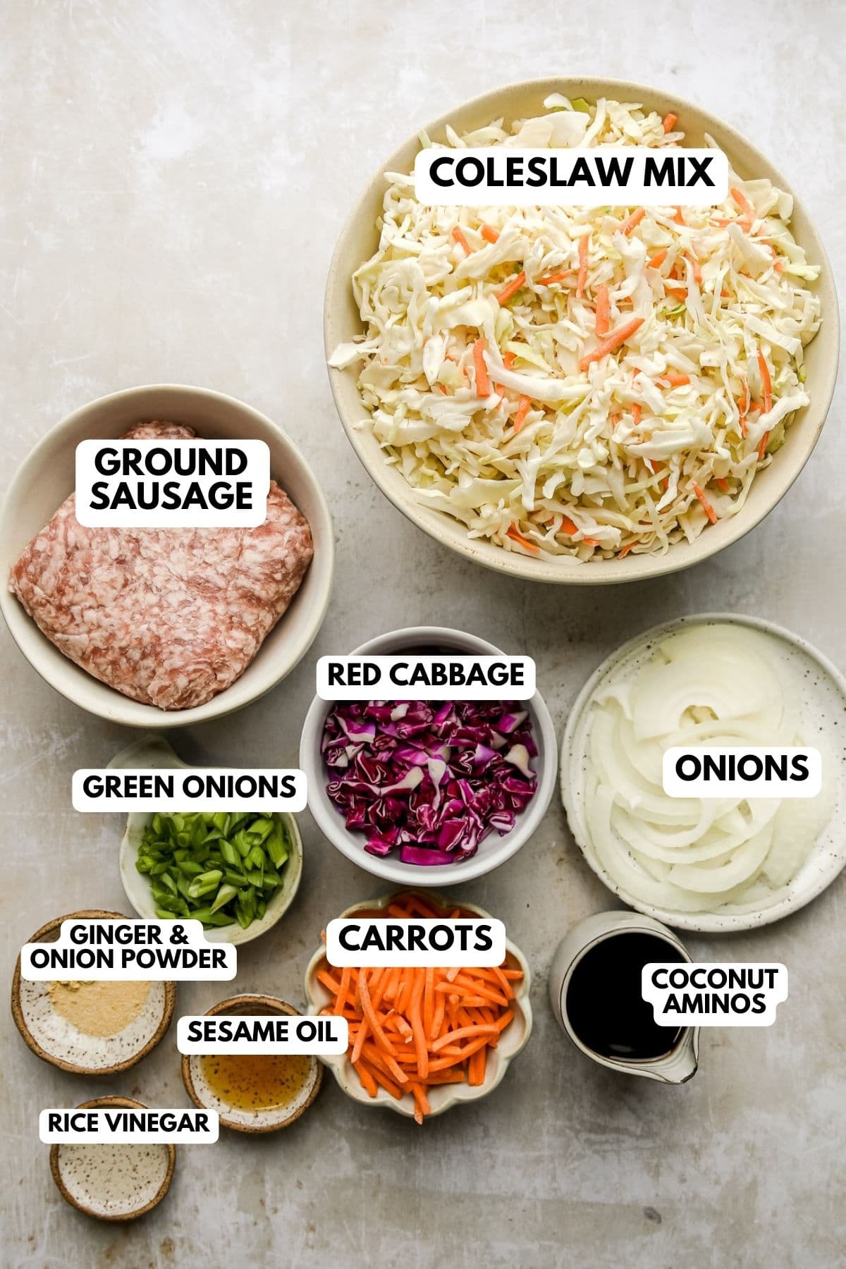 recipe ingredients in white bowls and labeled 