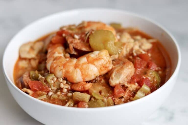 a white bowl filled with crockpot gumbo.