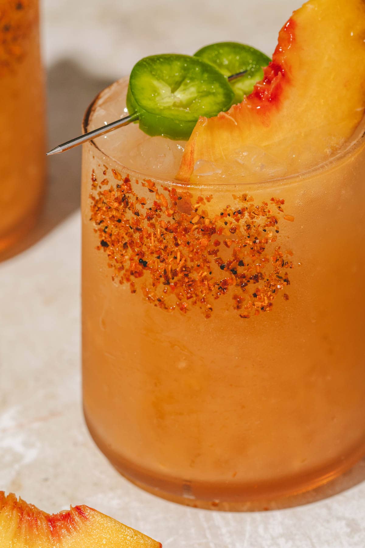a close up shot of a spicy peach drink 