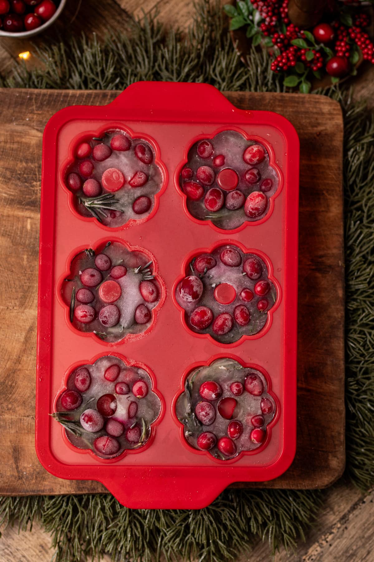 wreath shaped ice cubes in a red silicone tray
