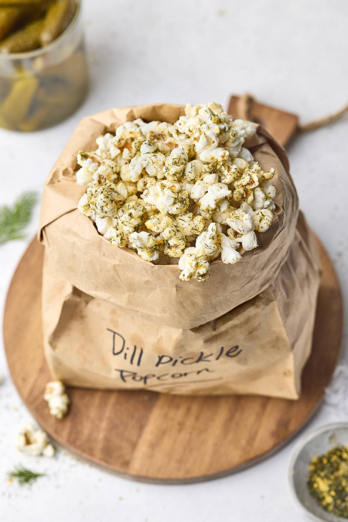 an overhead shot of popcorn covered in dill pickle seasoning