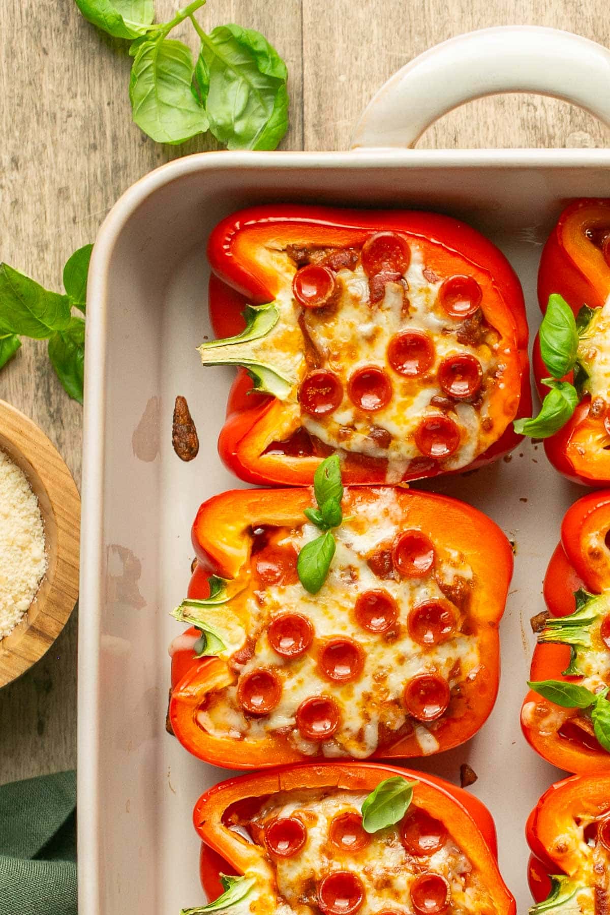 an up close shot of stuffed peppers in a baking dish