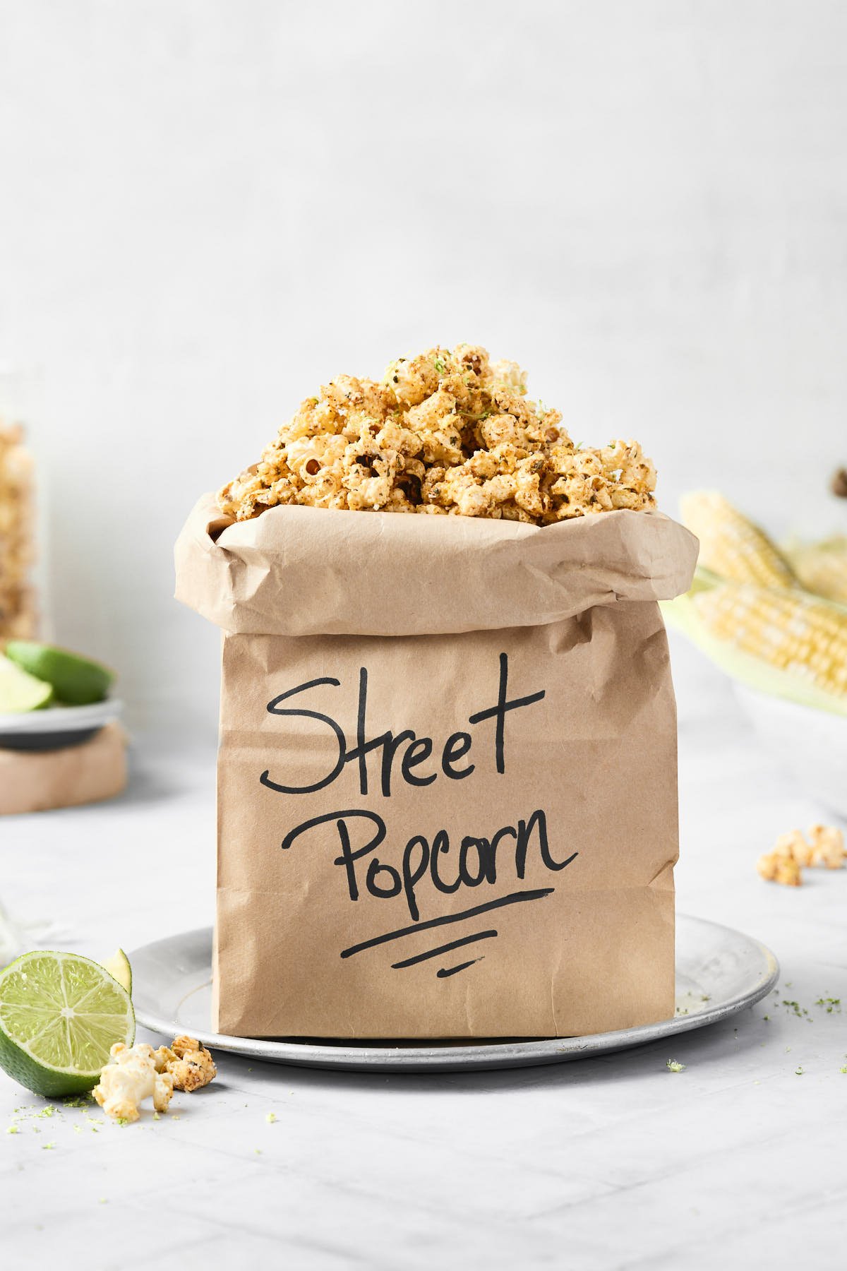 a brown paper bag with street corn popcorn inside