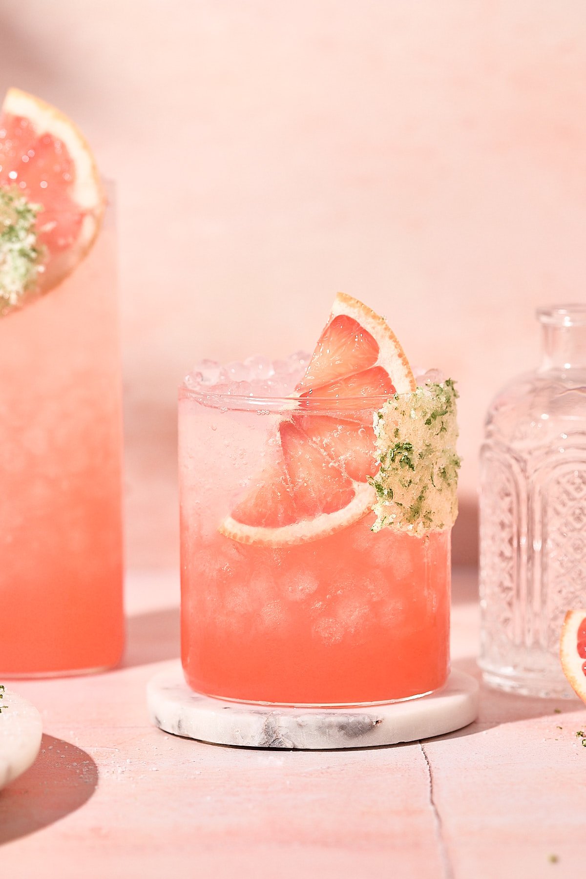 grapefruit juice, sparkling water and lime juice served over a glass of ice 