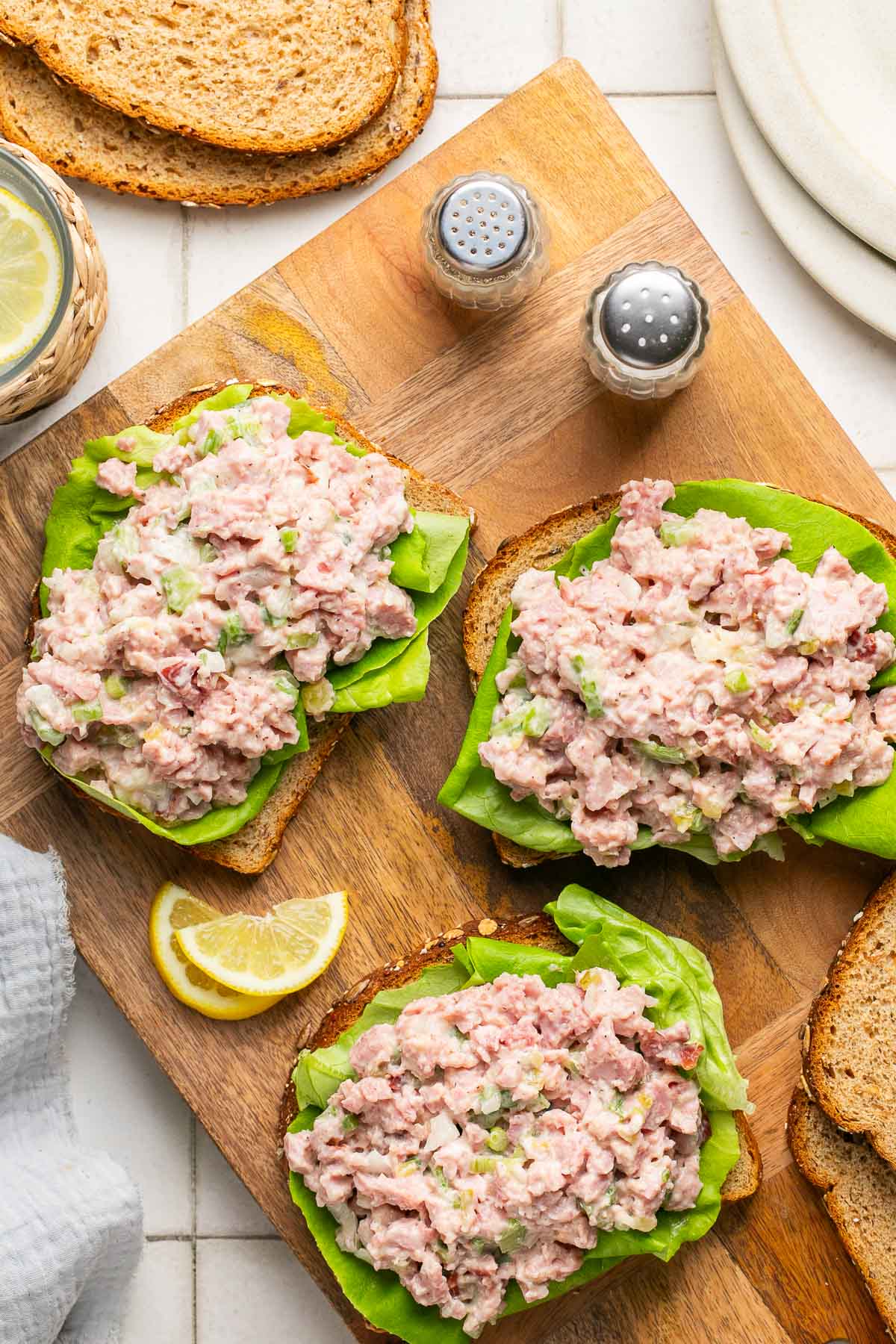 ham salad atop three slices of bread with lettuce