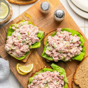 ham salad atop three slices of bread with lettuce