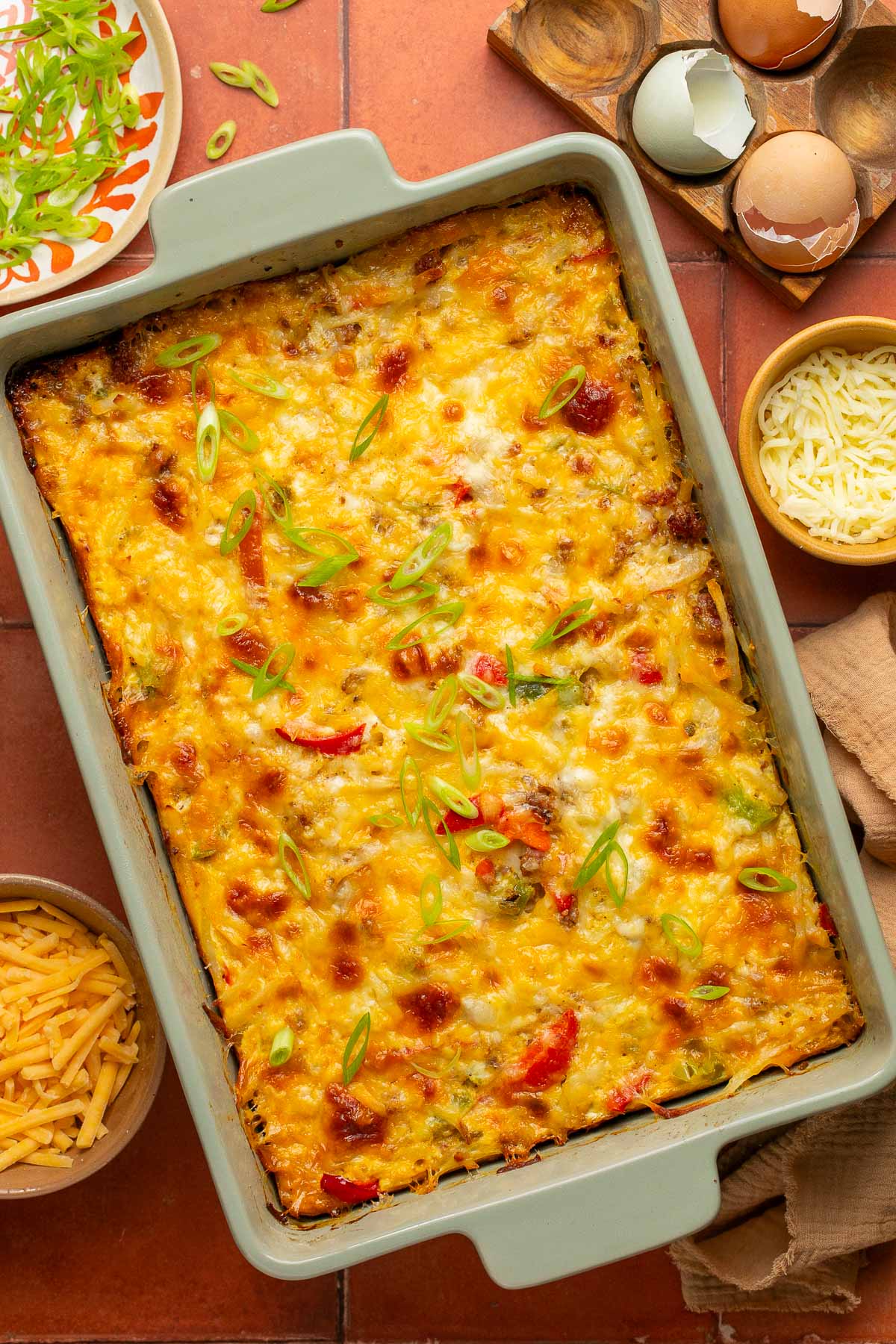 an overhead shot of a hash brown egg casserole in a baking dish