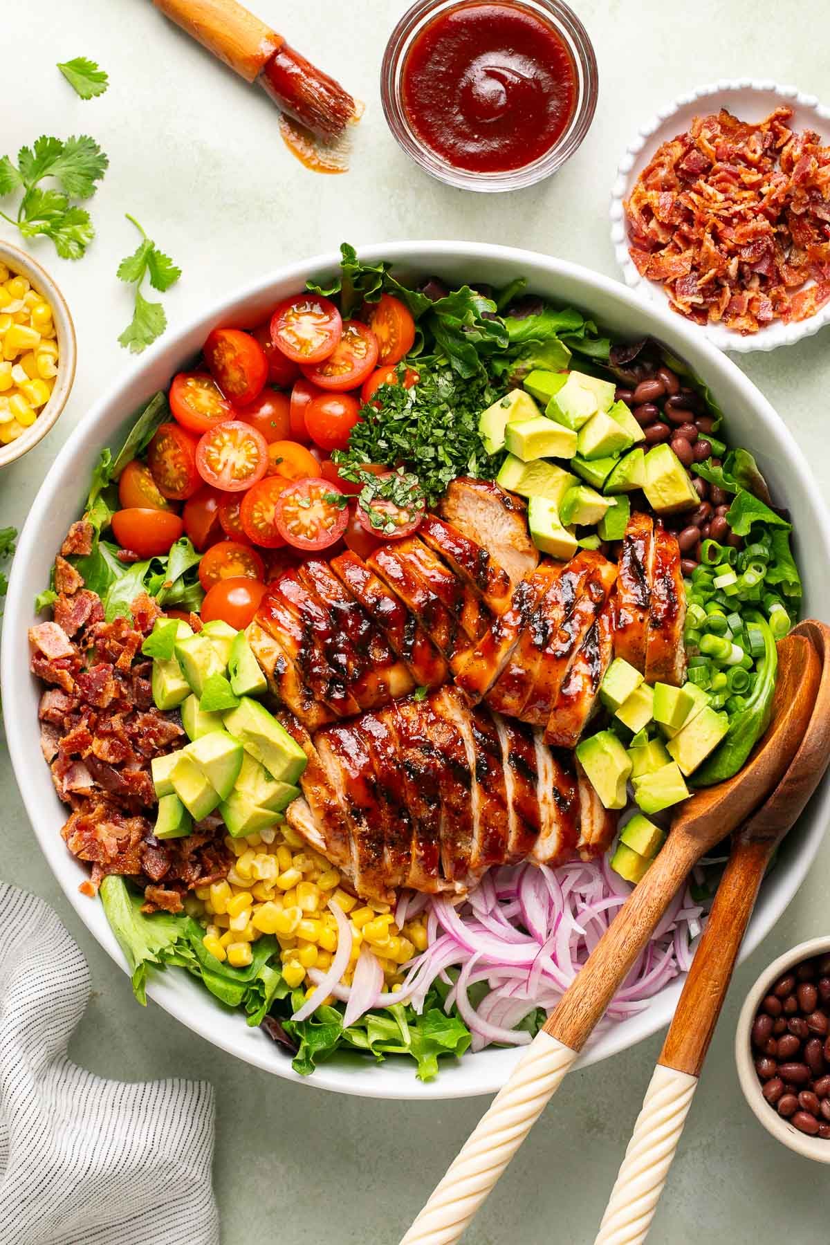 an overhead shot of BBQ chicken salad in a white salad bowl