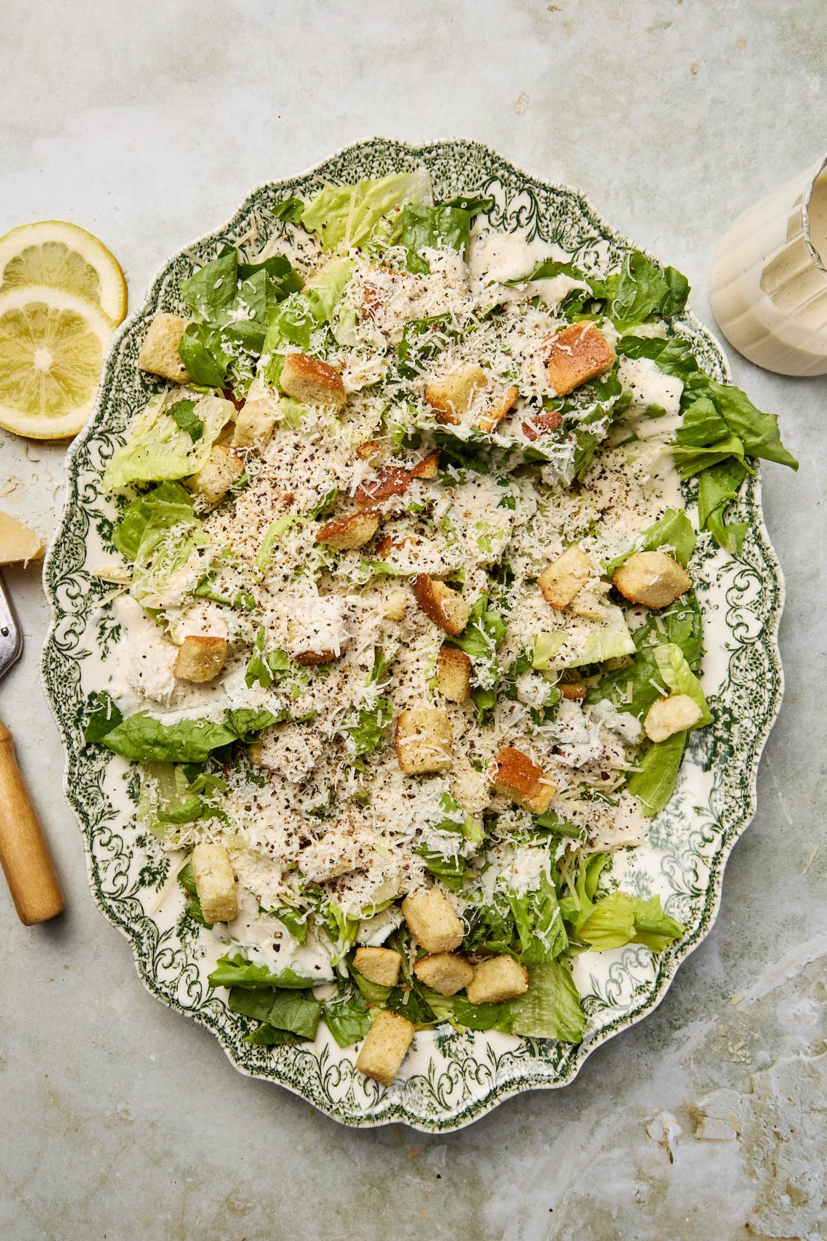 an overhead shot of a caesar salad on a serving platter