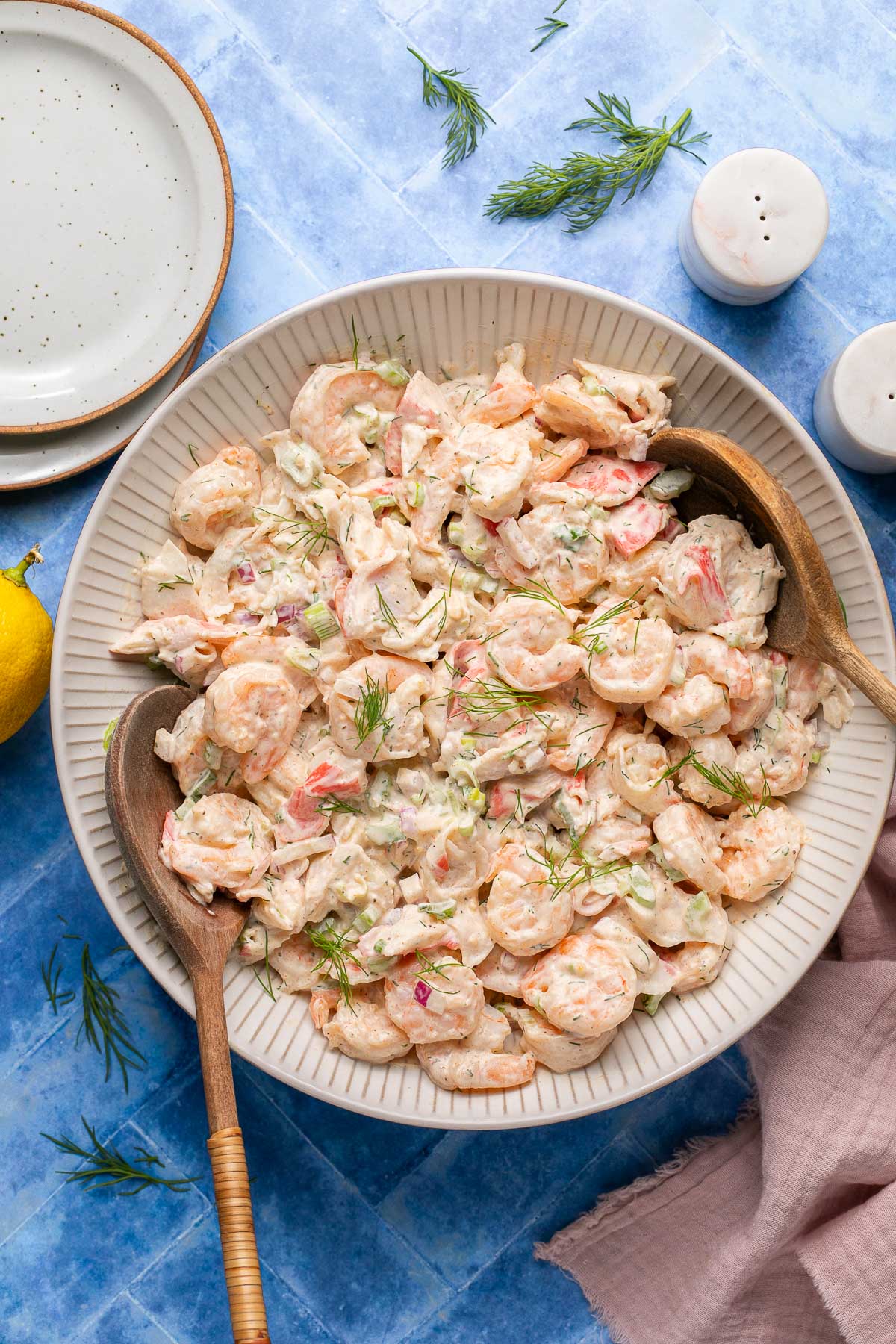 an overhead shot of a seafood salad tossed with creamy dressing 