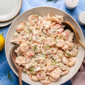 an overhead shot of a seafood salad tossed with creamy dressing