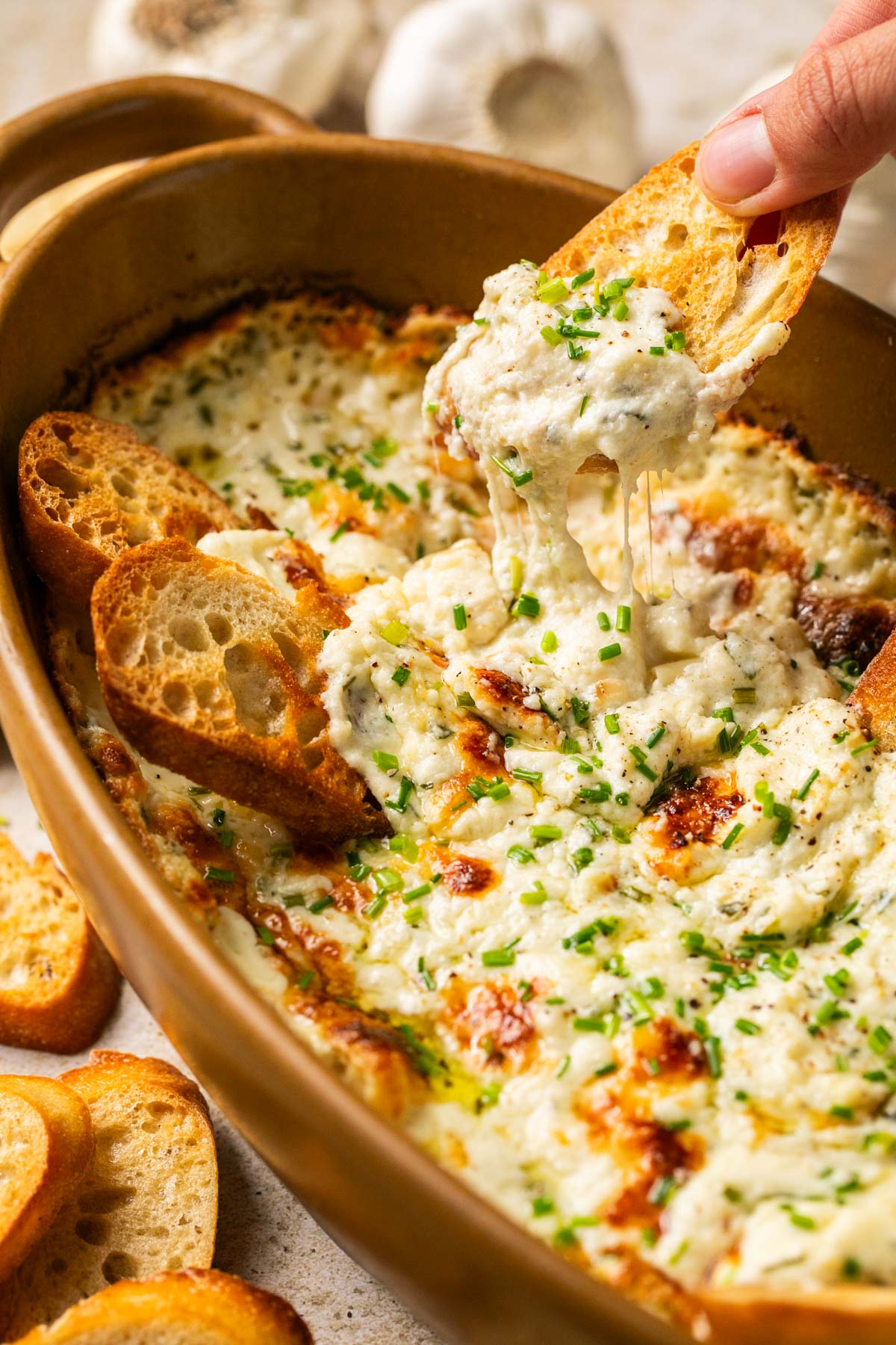 cheesy dip on a crostini