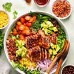 an overhead shot of BBQ chicken salad in a white salad bowl