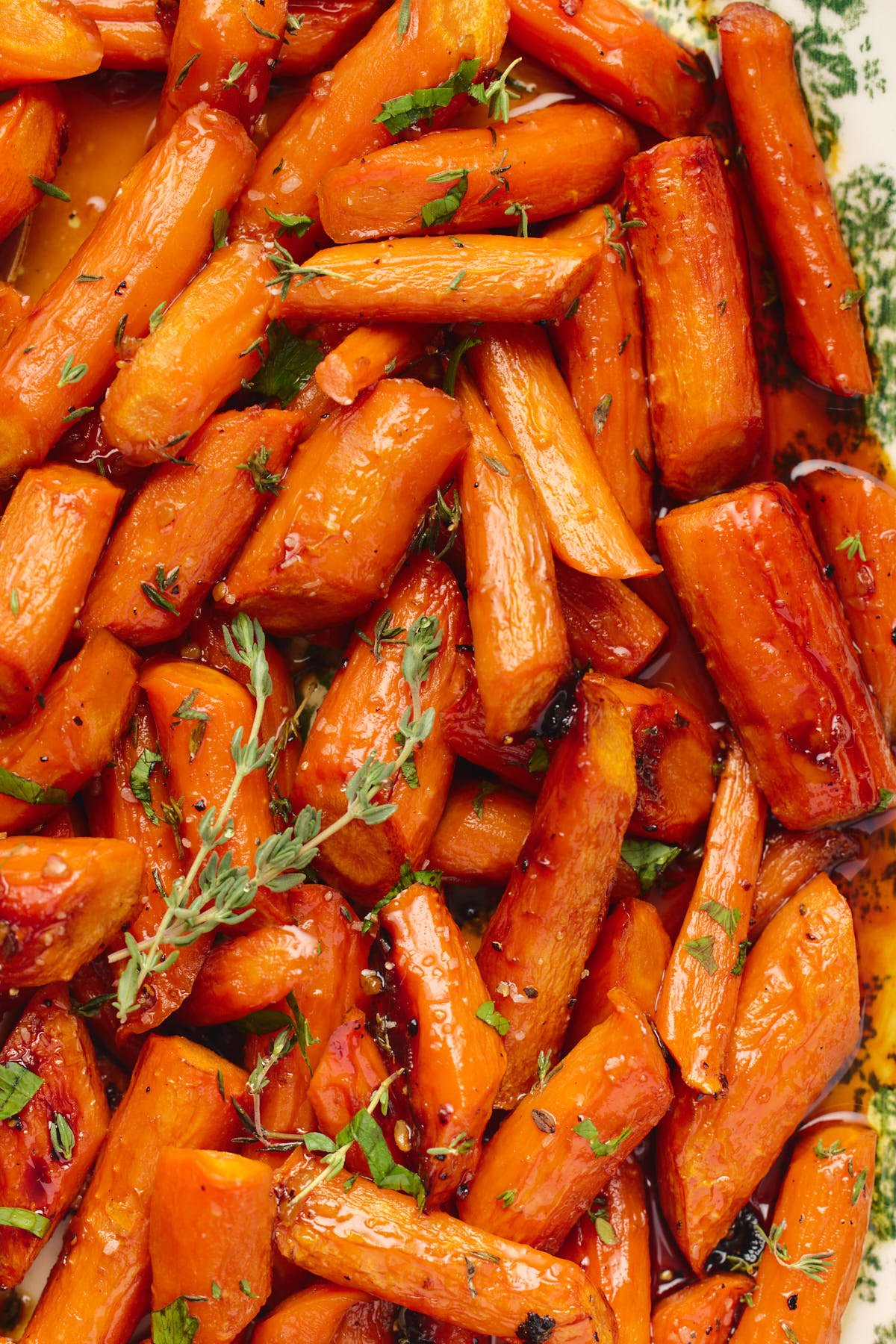 an up close shot of carrots roasted in a maple glaze 