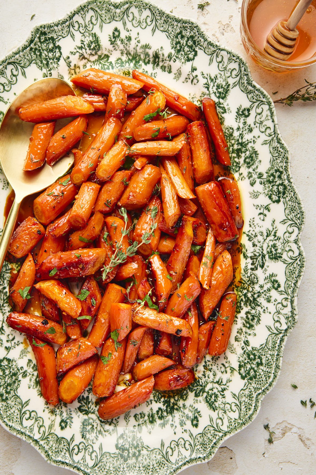 serving carrots from a serving dish 