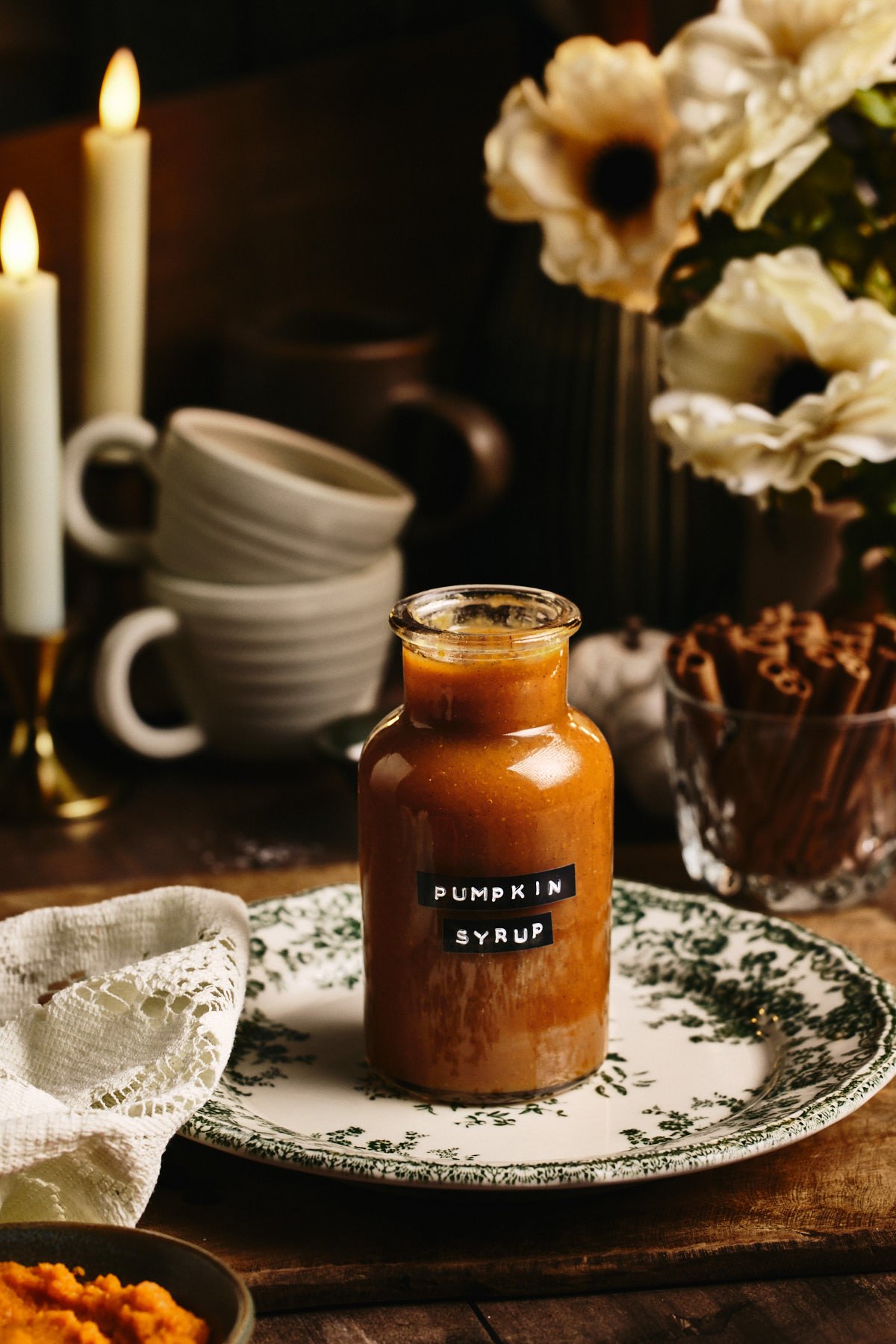 a close up photo of my pumpkin spice syrup recipe in a jar with a label