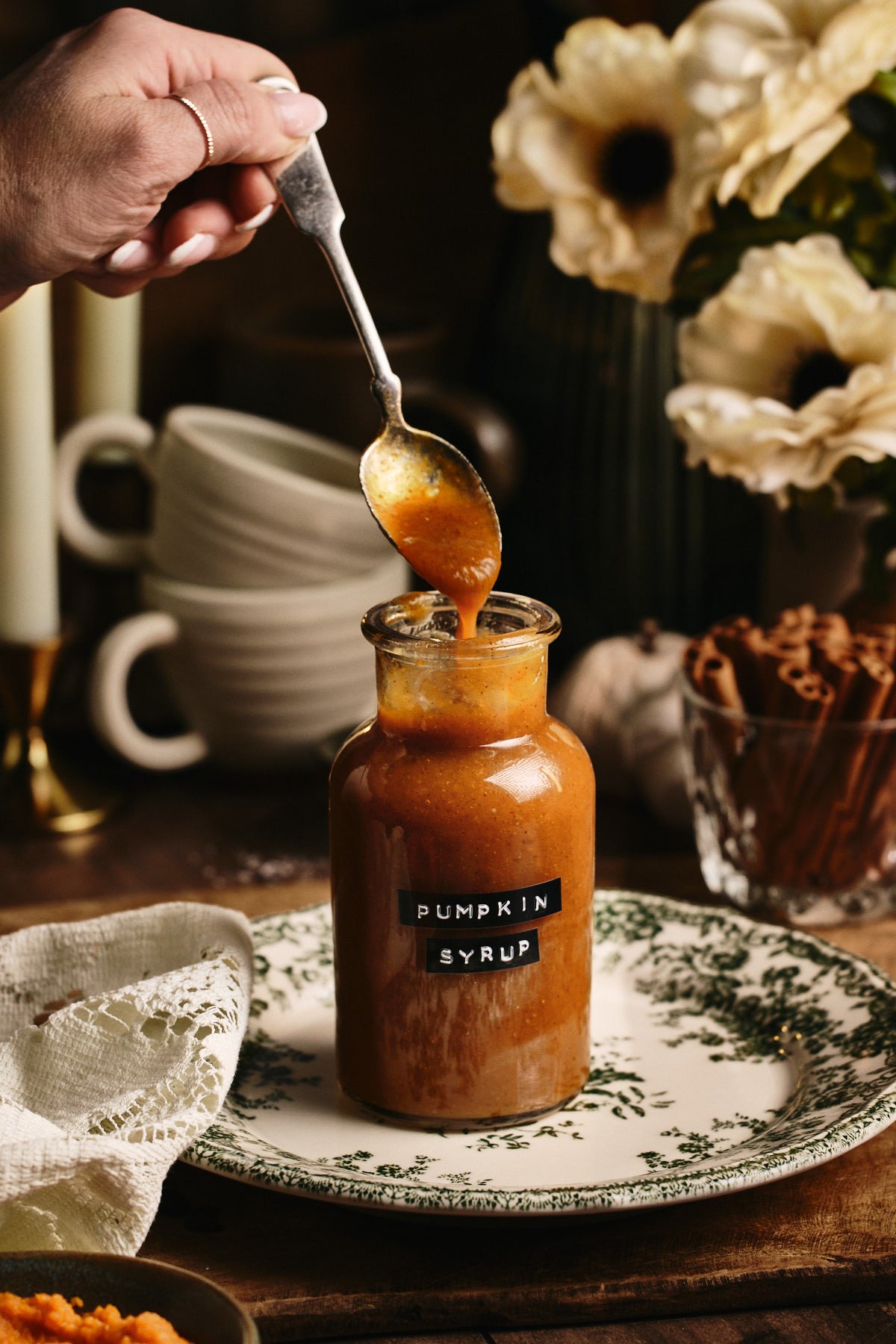  a spoon dripping the starbucks Pumpkin Spice Syrup