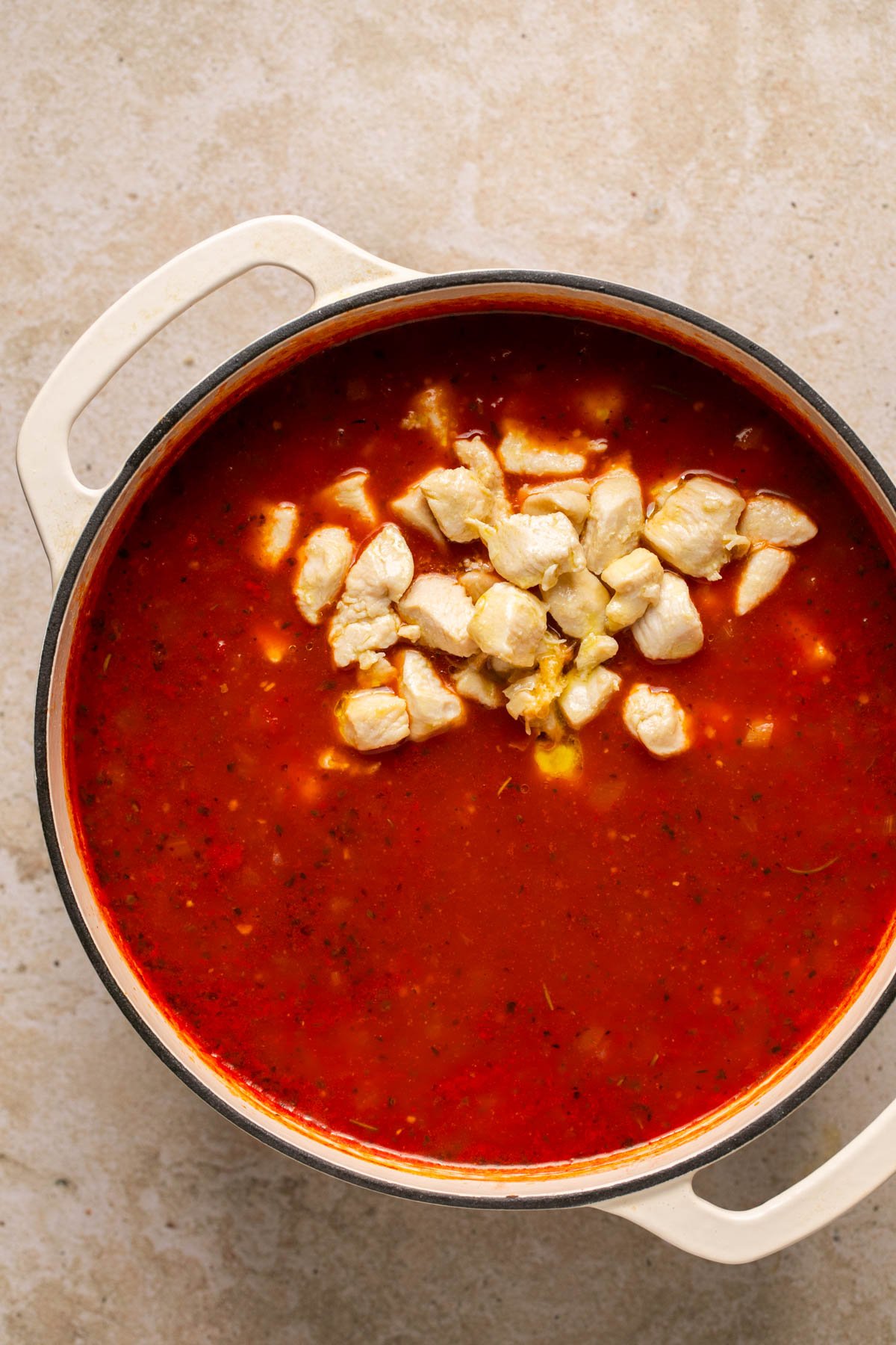 adding the chicken back to the chicken parmesan soup