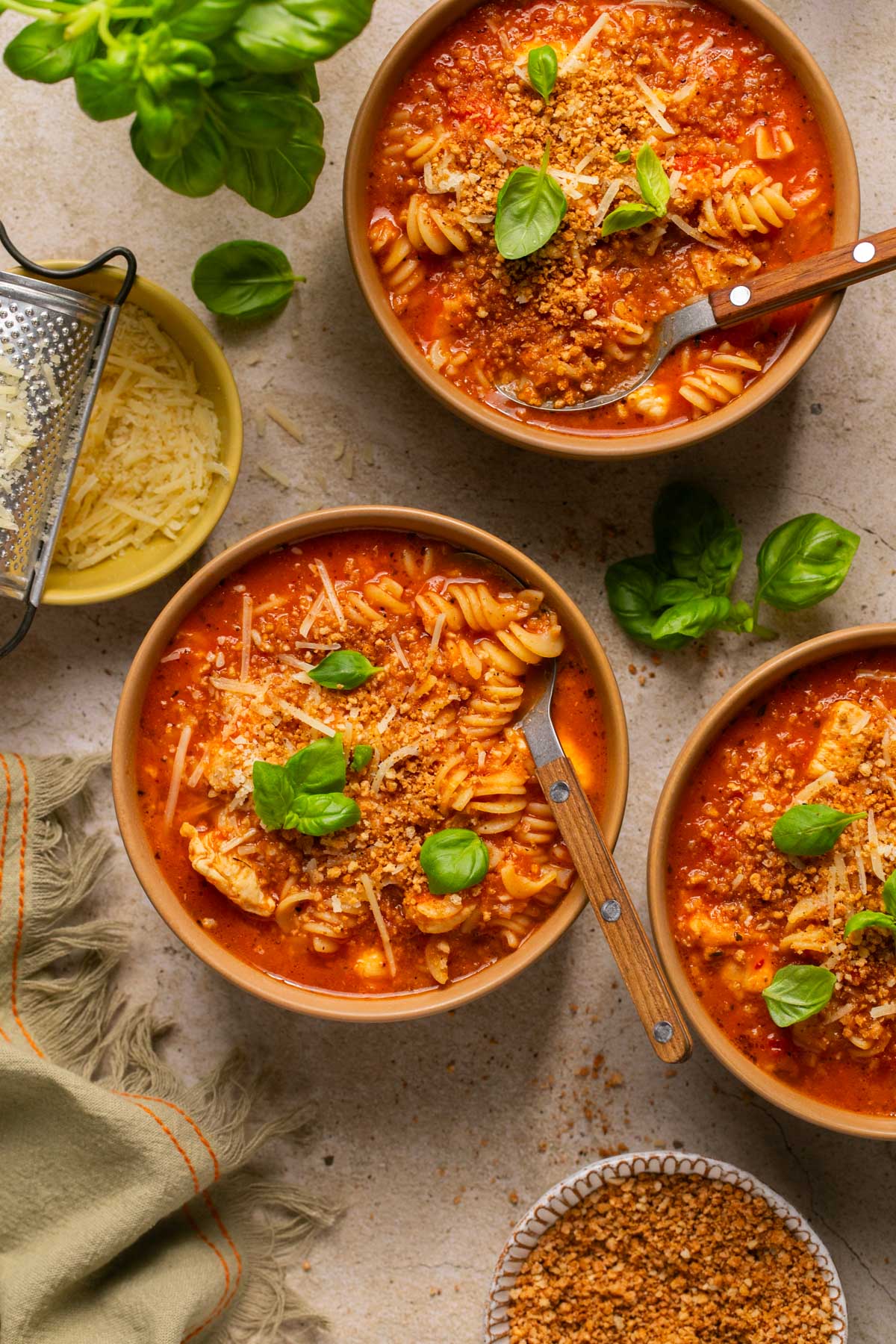 three bowls of chicken parmesan soup