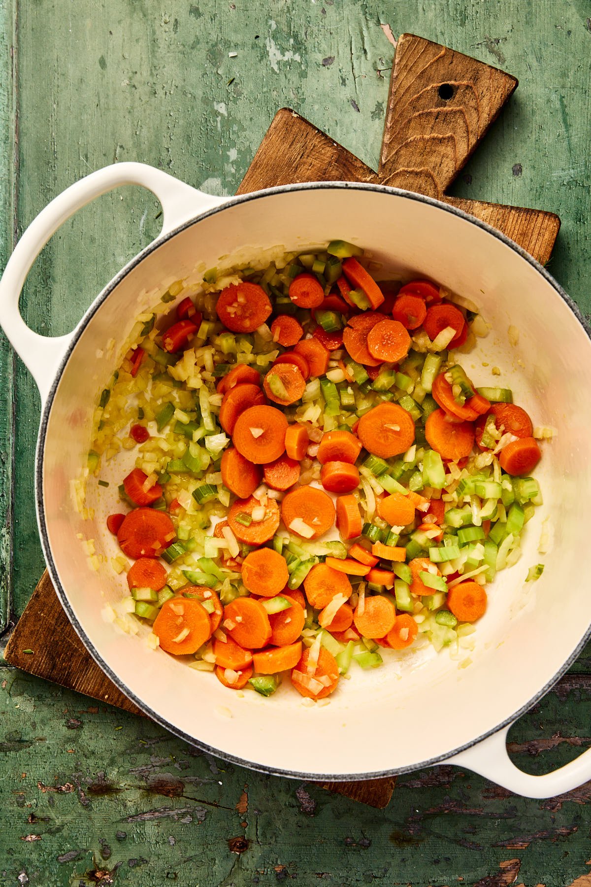 veggies in the bottom of a large soup pot