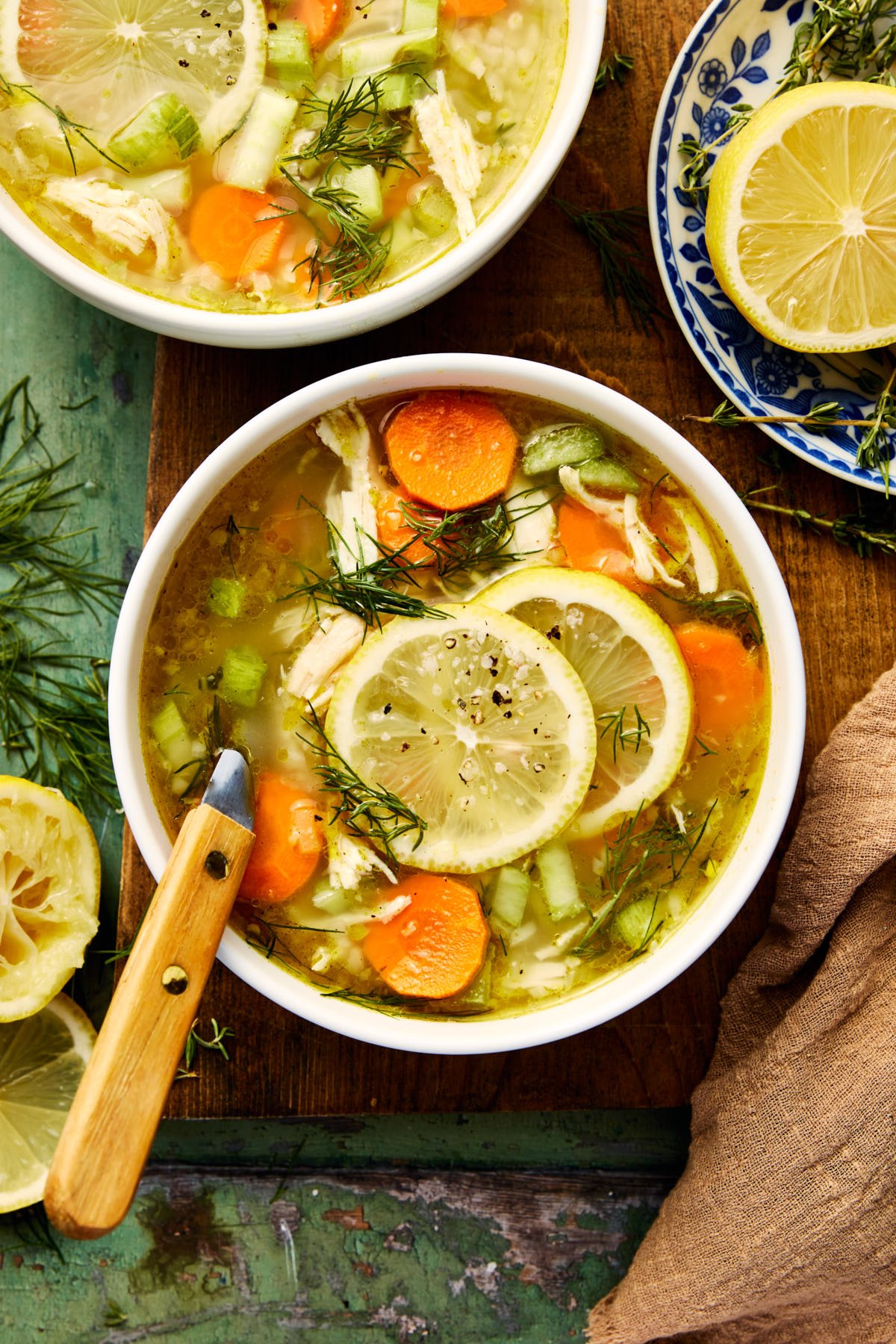 an overhead shot of lemon chicken soup in a bowl