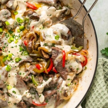 an overhead shot of philly cheesesteak casserole in a skillet