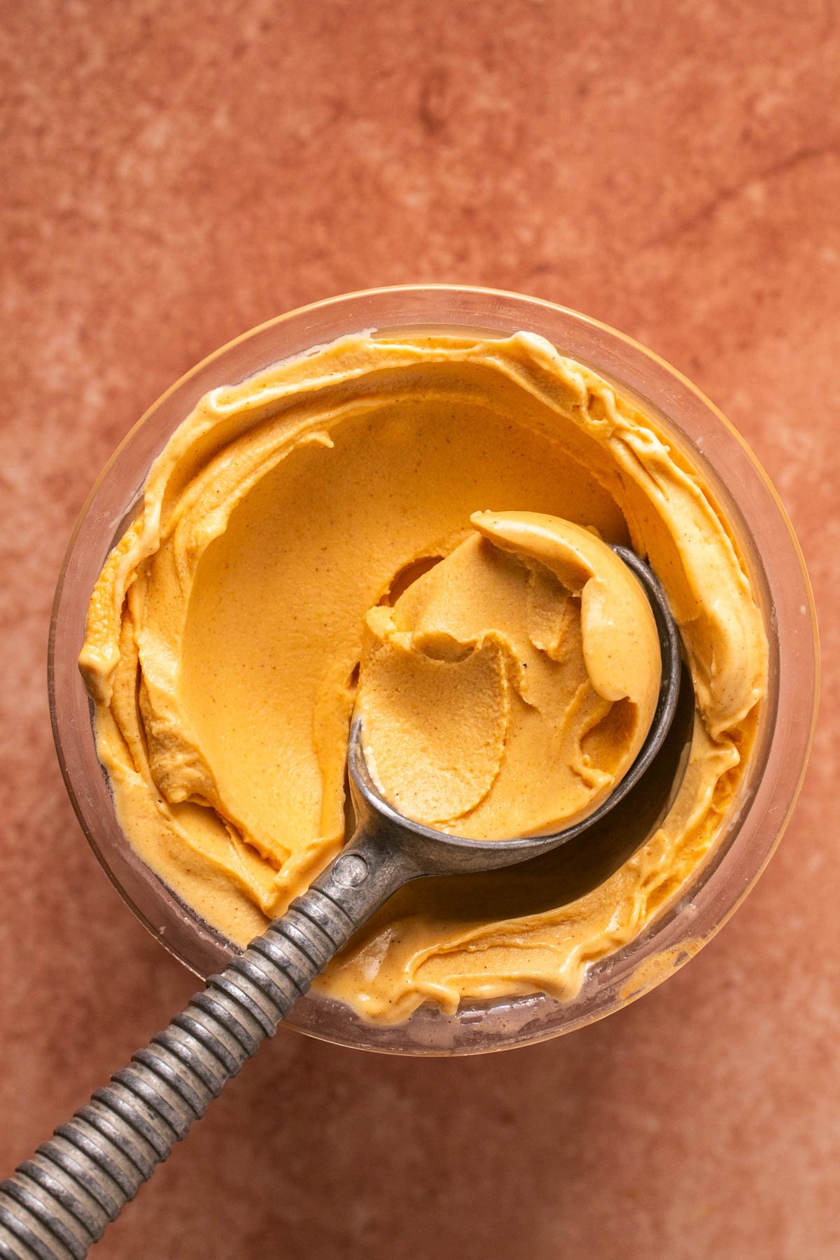 an ice cream scooper in a container