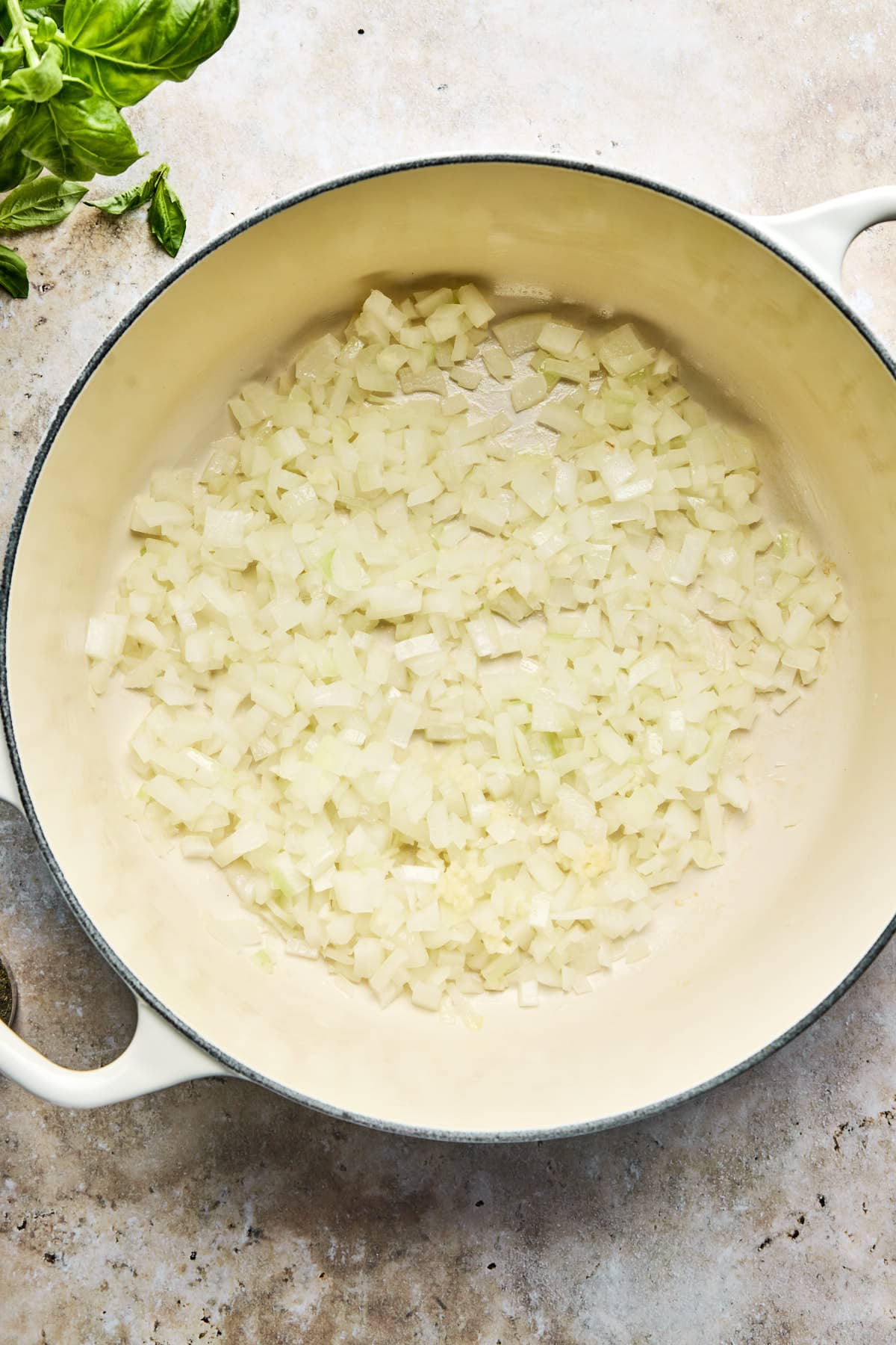 onions cooking in a large soup pot