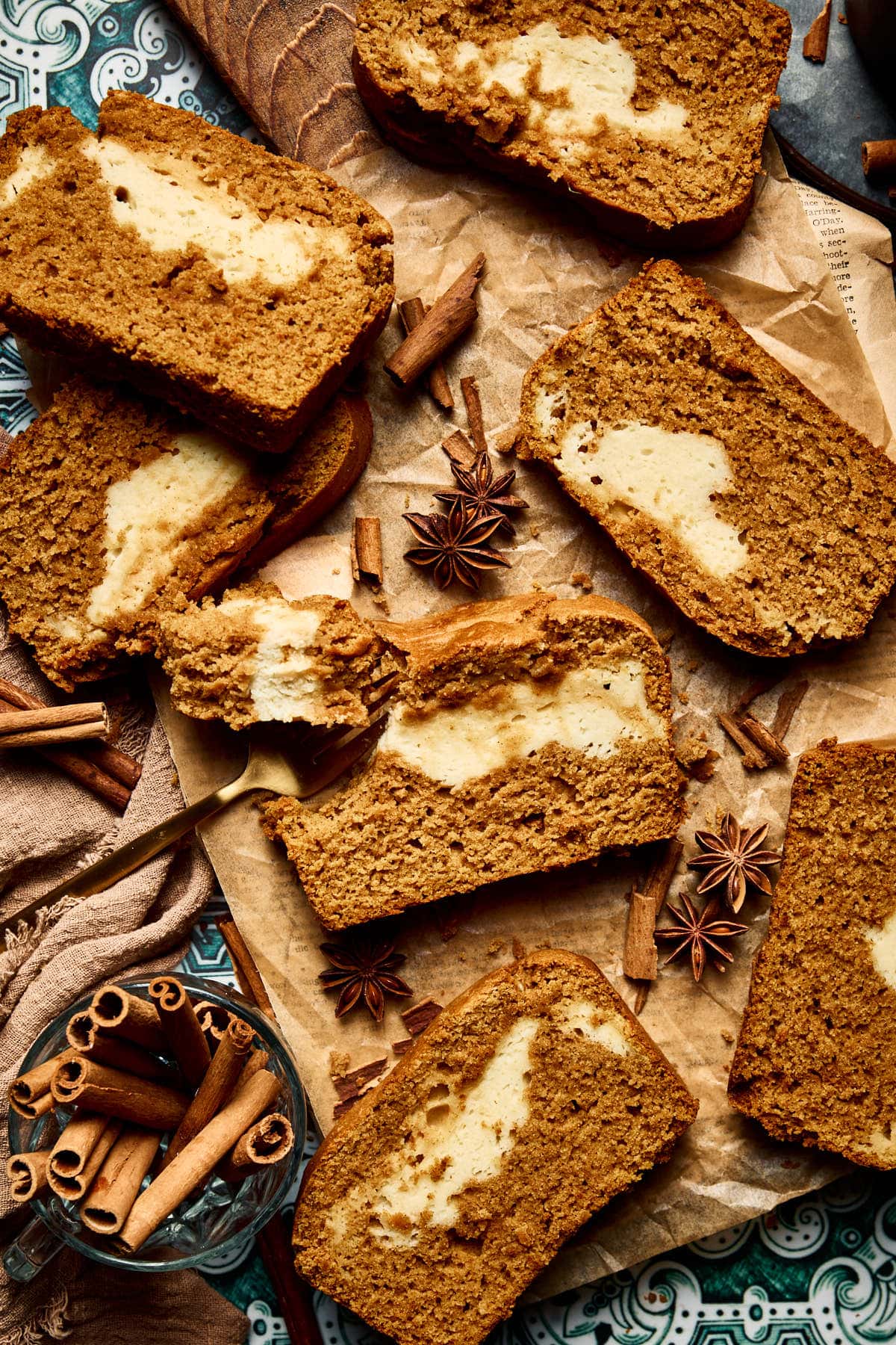 slices of pumpkin cream cheese bread on parchment paper